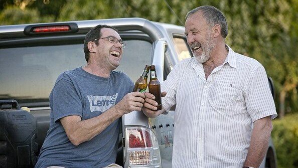 Simon Barbout and his neighbour Barry share a beer.