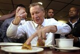 The US Republican presidential campaign new attack front: table manners. John Kasich's digs in, at a New York diner, April 16, 2016