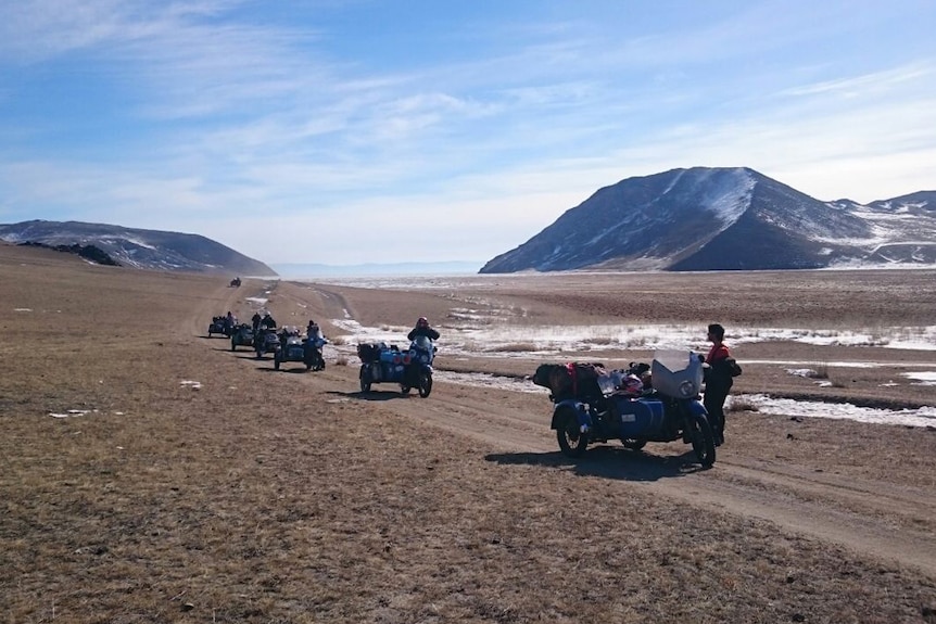 motorbikes crossing mountains