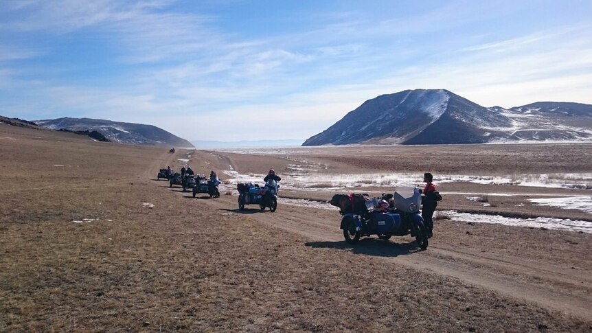 motorbikes crossing mountains