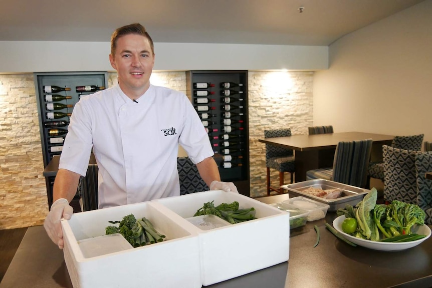 A Touch Of Salt chef Mr Brine poses with his new gourmet, cook-at-home boxes.