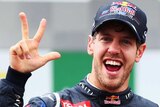 Best there is ... Red Bull's Sebastian Vettel celebrates with team-mates after securing a third-straight world title.