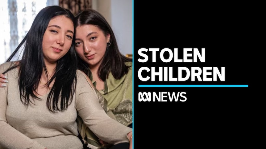 Stolen Children: Two women in black hair with their heads leaned against each other.