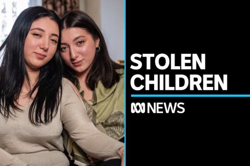 Stolen Children: Two women in black hair with their heads leaned against each other.