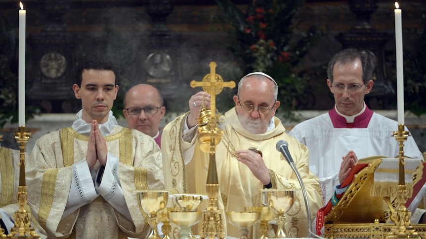 Newly elected Pope Francis, Jorge Mario Bergoglio of Argentina (2nd right), leads his first mass (Reuters/Osservatore Romano)