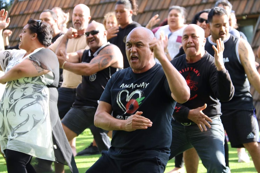 Leon leads the men through the war dance rehearsal in the park on Sunday.