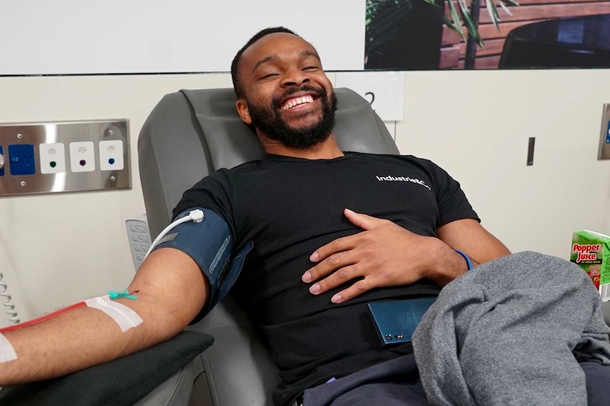 A man donates blood in Sydney.