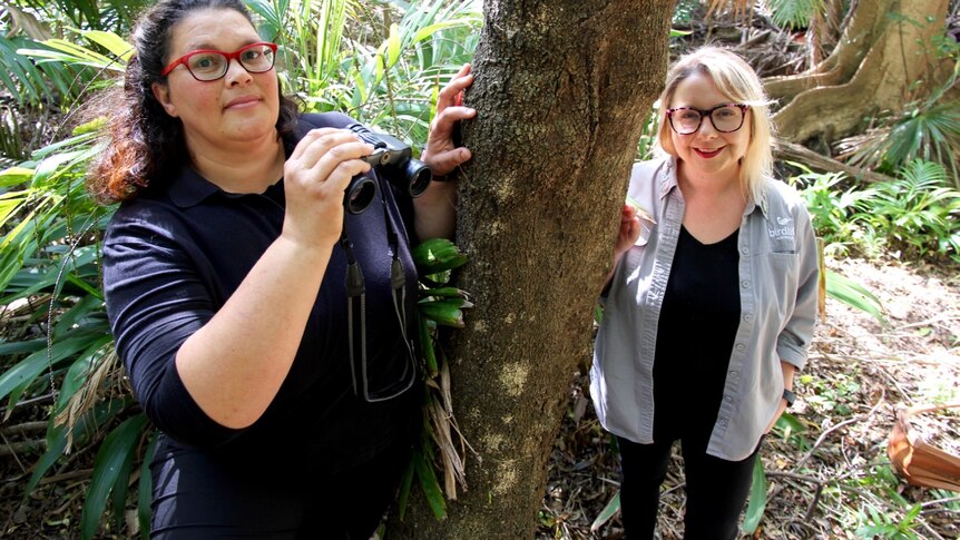 Two women, Dr Beth Nott and Dr Holly Parsons, standing in a rainforest