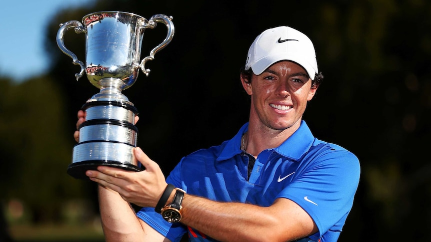 To the victor the spoils ... Rory McIlroy holds aloft the Stonehaven Cup