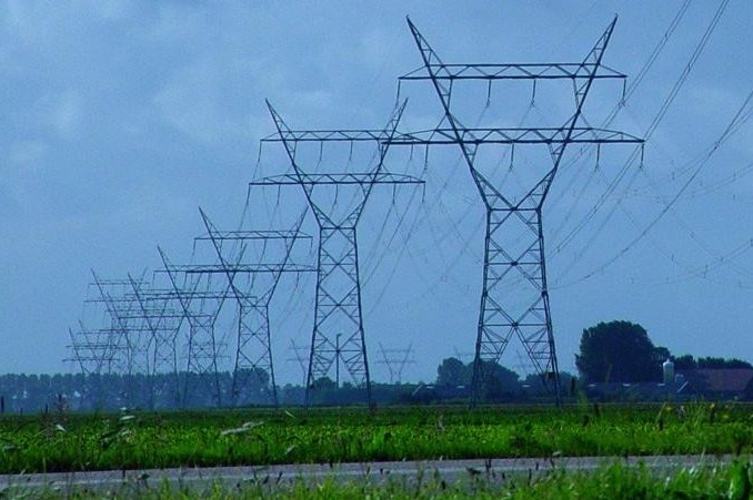 High voltage powerlines run across a property