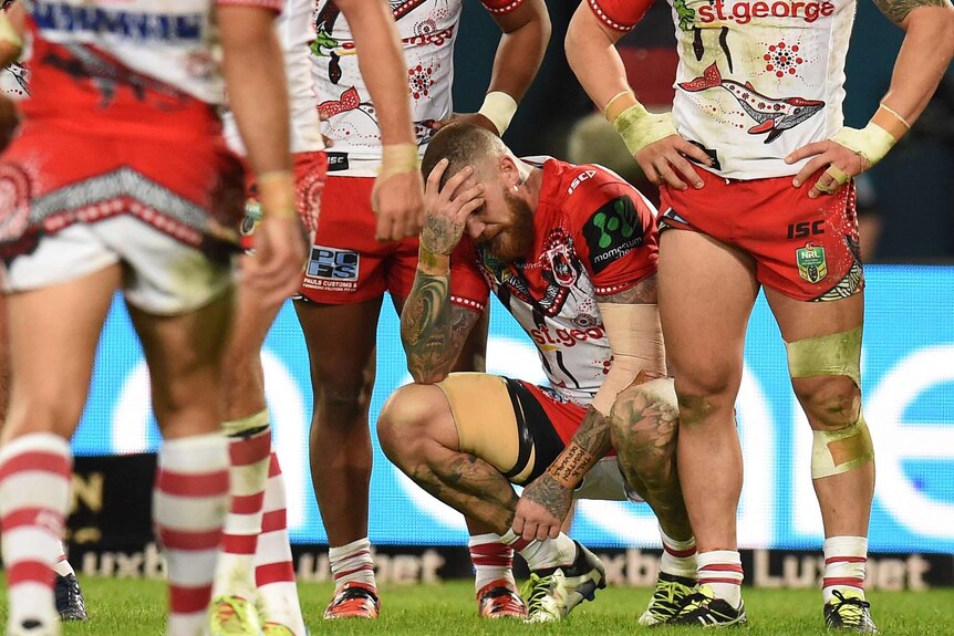 Josh Dugan carries his injured left arm after losing to South Sydney