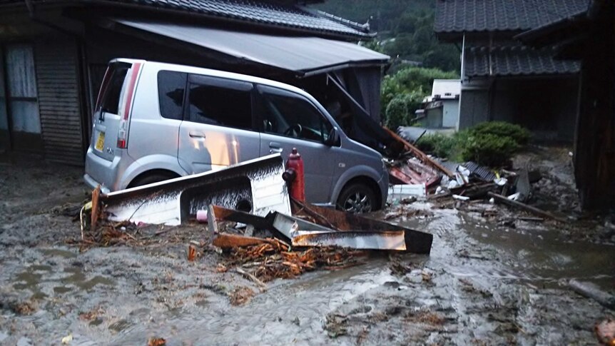 Cars and buildings damaged after a landslide caused by Typhoon Neoguri, in Japan's Nagano prefecture.