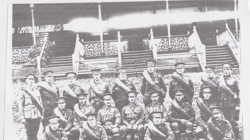 Black-and-white photo of the 16th army battalion in front of a grandstand