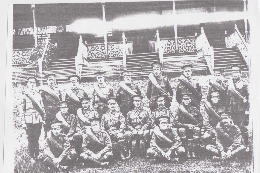 Black-and-white photo of the 16th army battalion in front of a grandstand