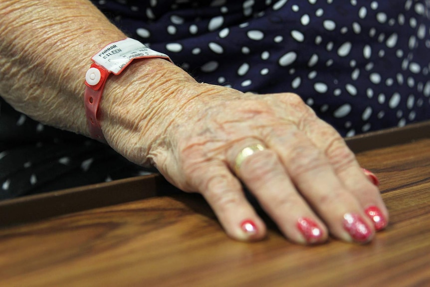 A photo of Eileen Farrar's hospital admission band, which matches her nails.