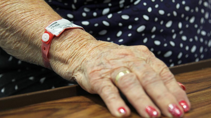A photo of Eileen Farrar's hospital admission band, which matches her nails.