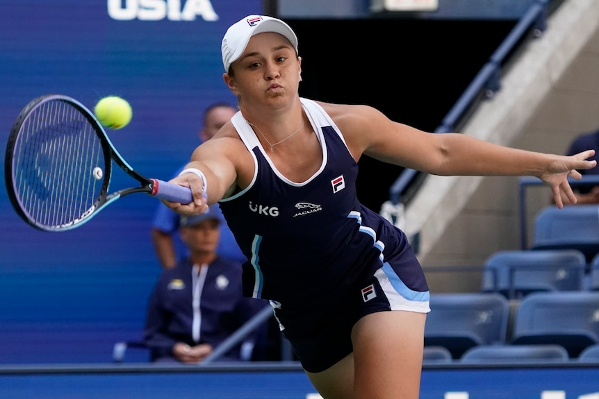 Ash Barty stretches to hit a forehand.