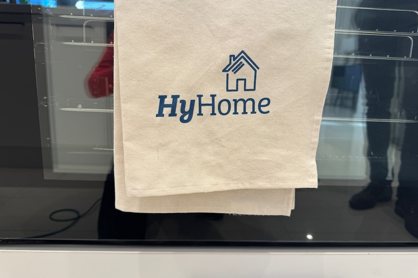 a teatowel on a stove saying hyhome