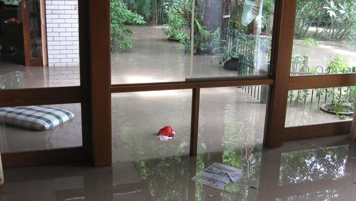 Falling floodwaters in lounge room
