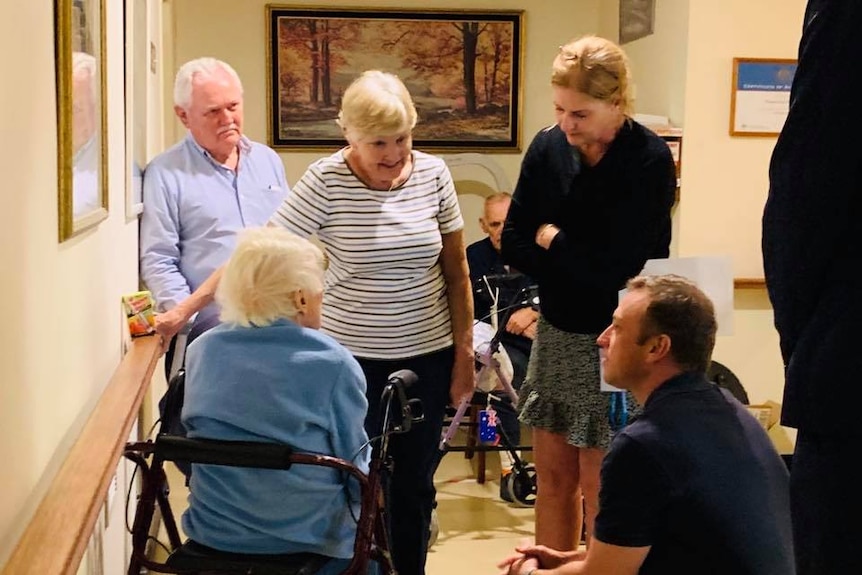 Mr Miles with residents at the retirement village.