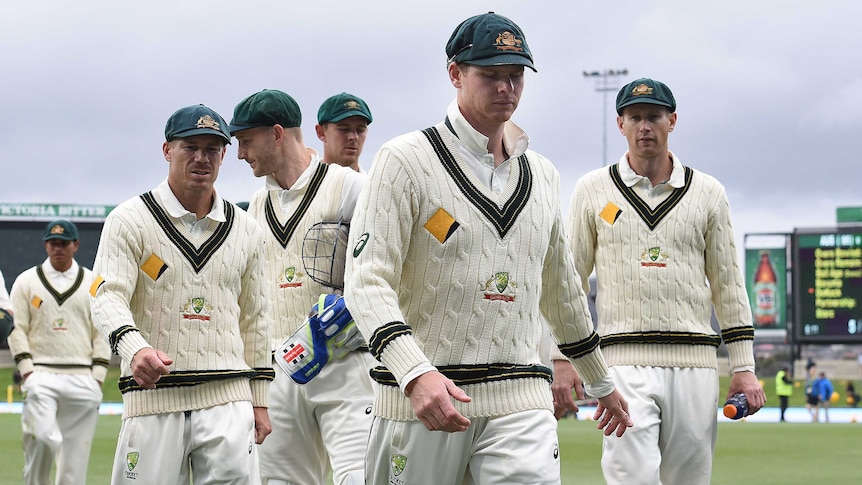 Australian captain Steve Smith leads his team off after day one of second Test with South Africa.