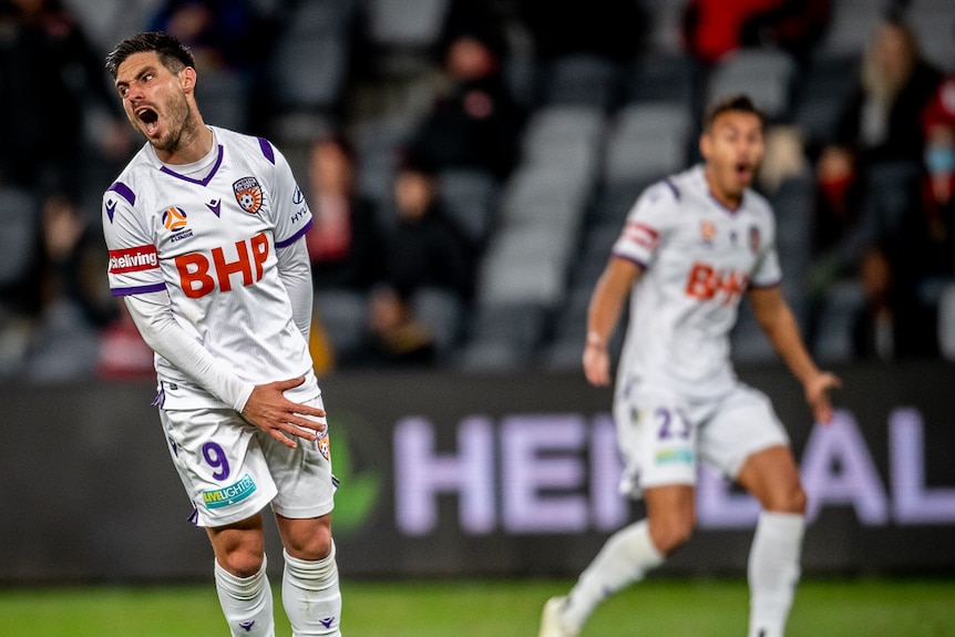 Bruno Fornaroli jumps up and turns to his right with an angry look on his face