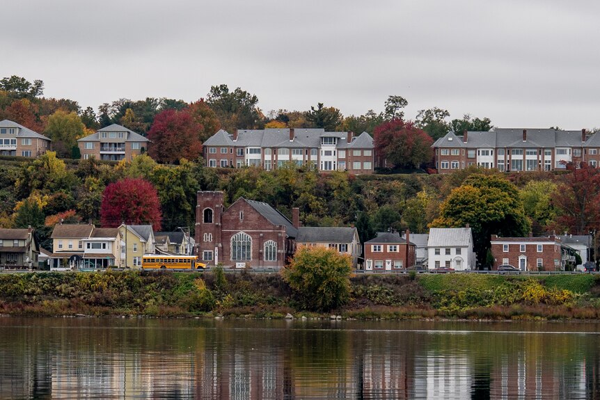 A collection of suburban houses along a riverbank in Pennsylvania