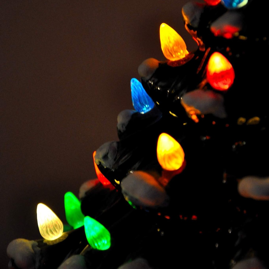 Close up of multi-coloured lights on a Christmas ornament.