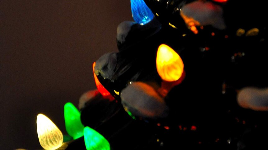 Close up of multi-coloured lights on a Christmas ornament.