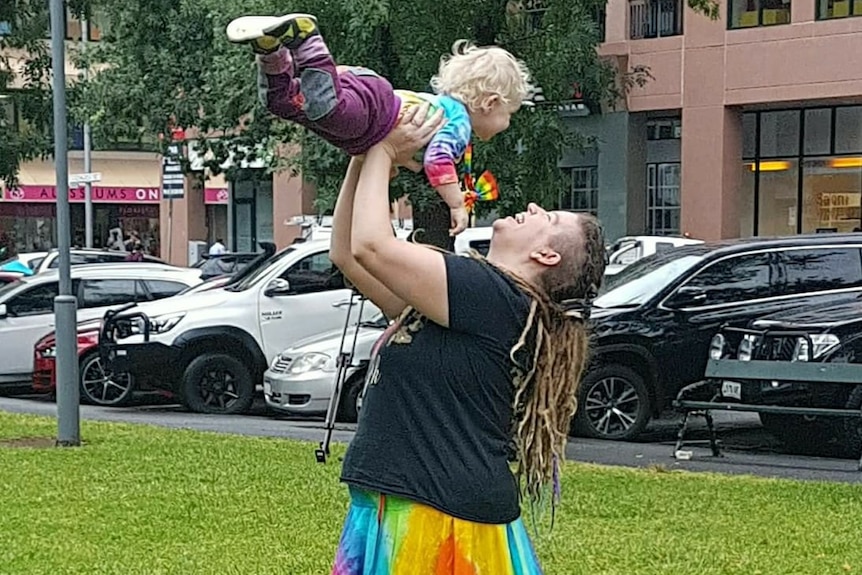 Ms Reece holds her daughter in a park