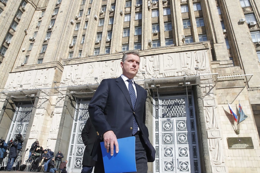 Australian ambassador to Russia Peter Tesch leaves the Russian foreign ministry building in Moscow.