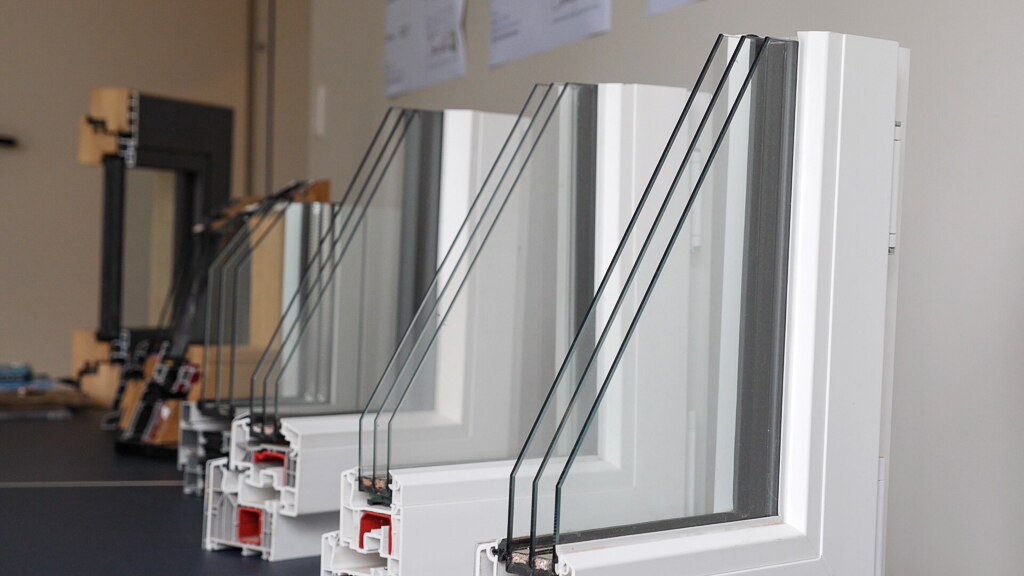 cutaway sections of window frames showing triple layers of glass