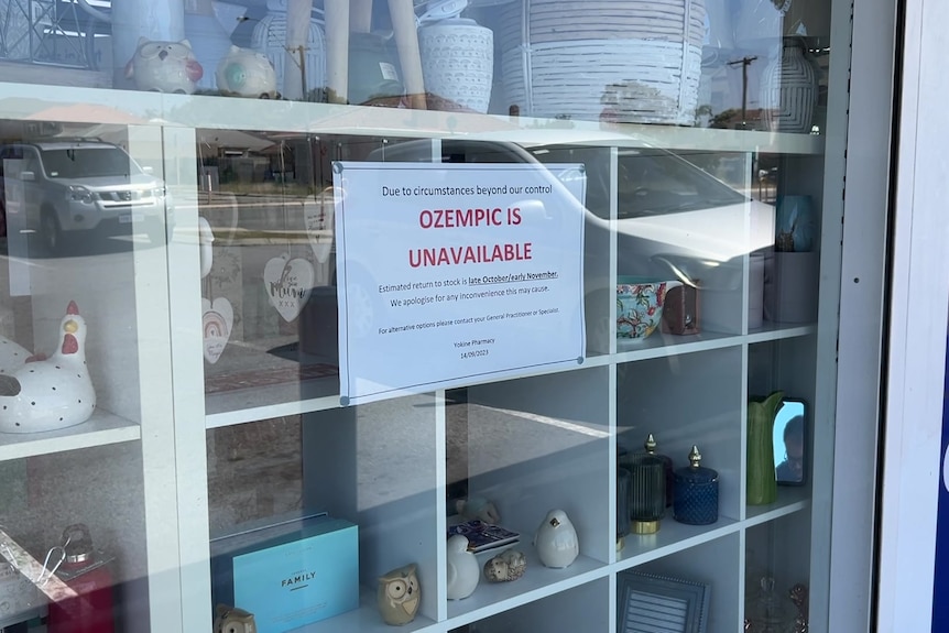A sign in a shop window that says 'Ozempic is unavailable'