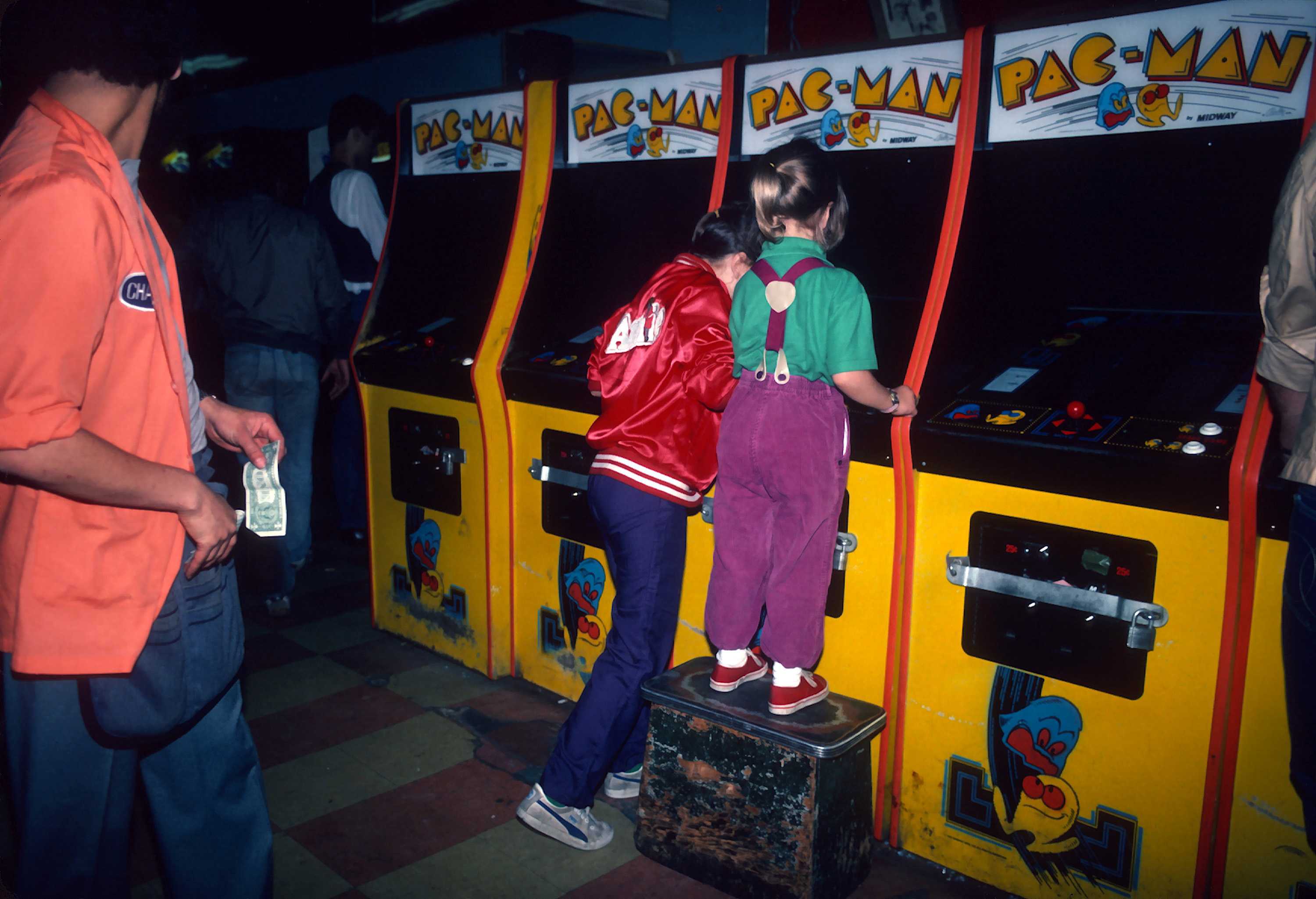 Girls playing Pac-Man