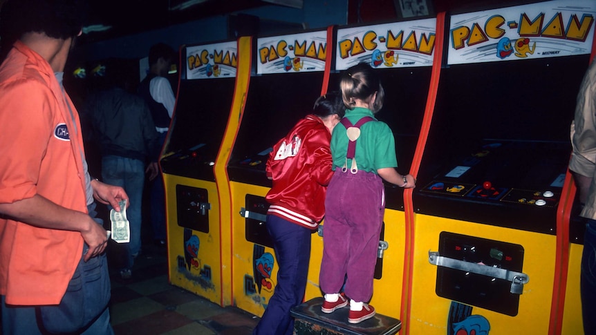 Girls playing Pac-Man