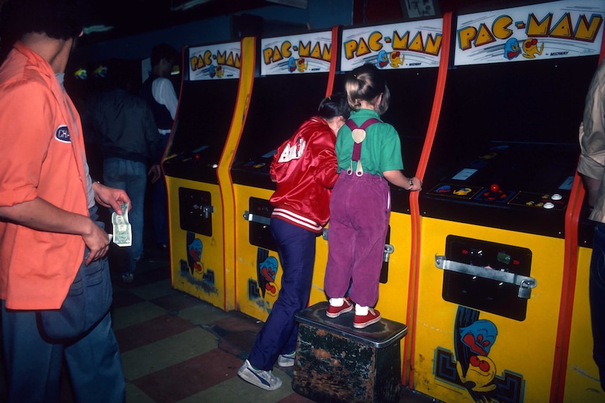 Girls playing Pac-Man