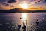 Sunset over Hobart's Mount Wellington/kunanyi with sailboats on the Derwent.