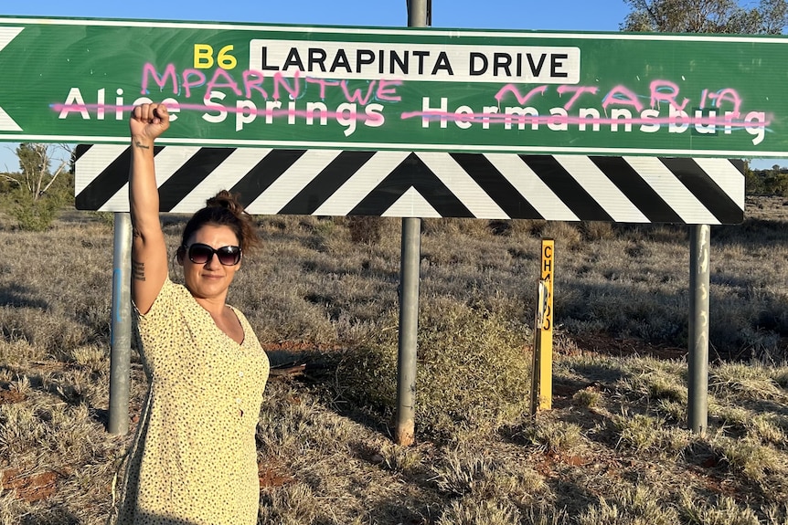 Lidia Thorpe raised her first to the air in front of a Central Australian road sign