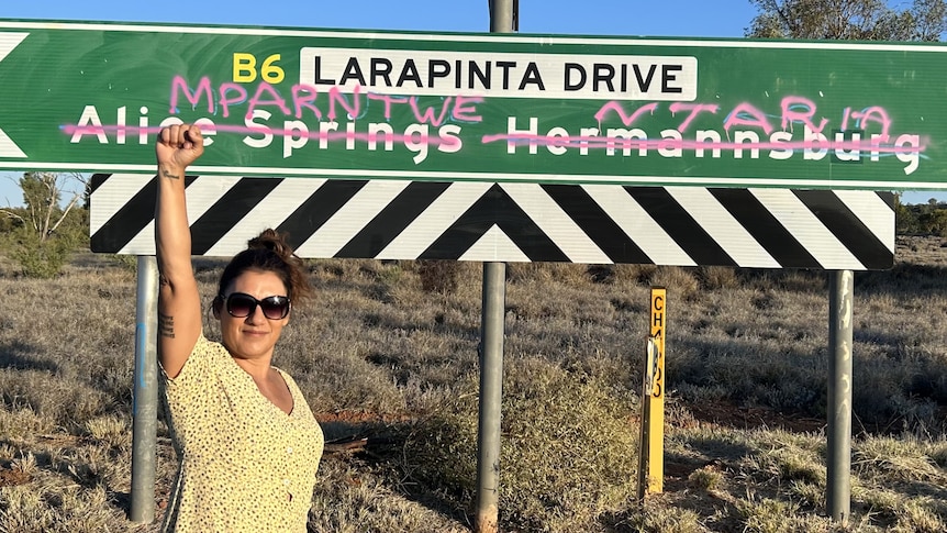 Lidia Thorpe raised her first to the air in front of a Central Australian road sign