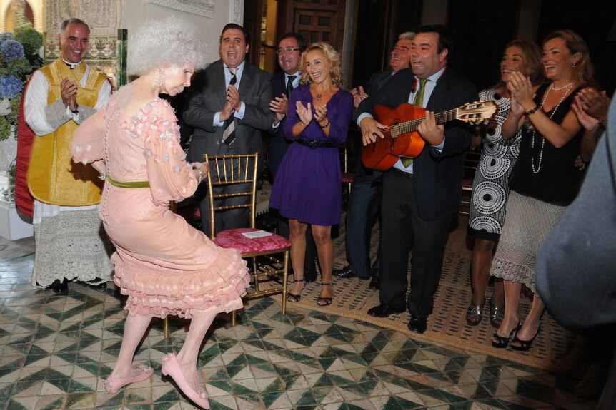 Spain's Duchess of Alba, Maria del Rosario Cayetana Fitz-James-Stuart, dances during her wedding ceremony