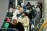 Commuters wearing masks on the train.