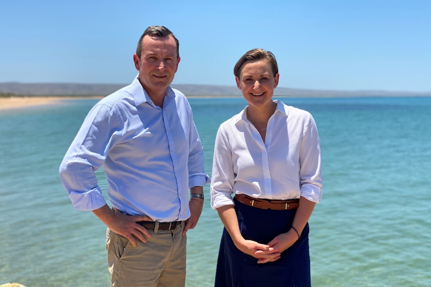 Premier Mark McGowan and Environment Minister Amber-Jade Sanderson in front of the ocean.