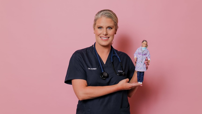 Kirby White with a Barbie doll made in her image, as part of a special series honouring women fighting the COVID-19 pandemic.