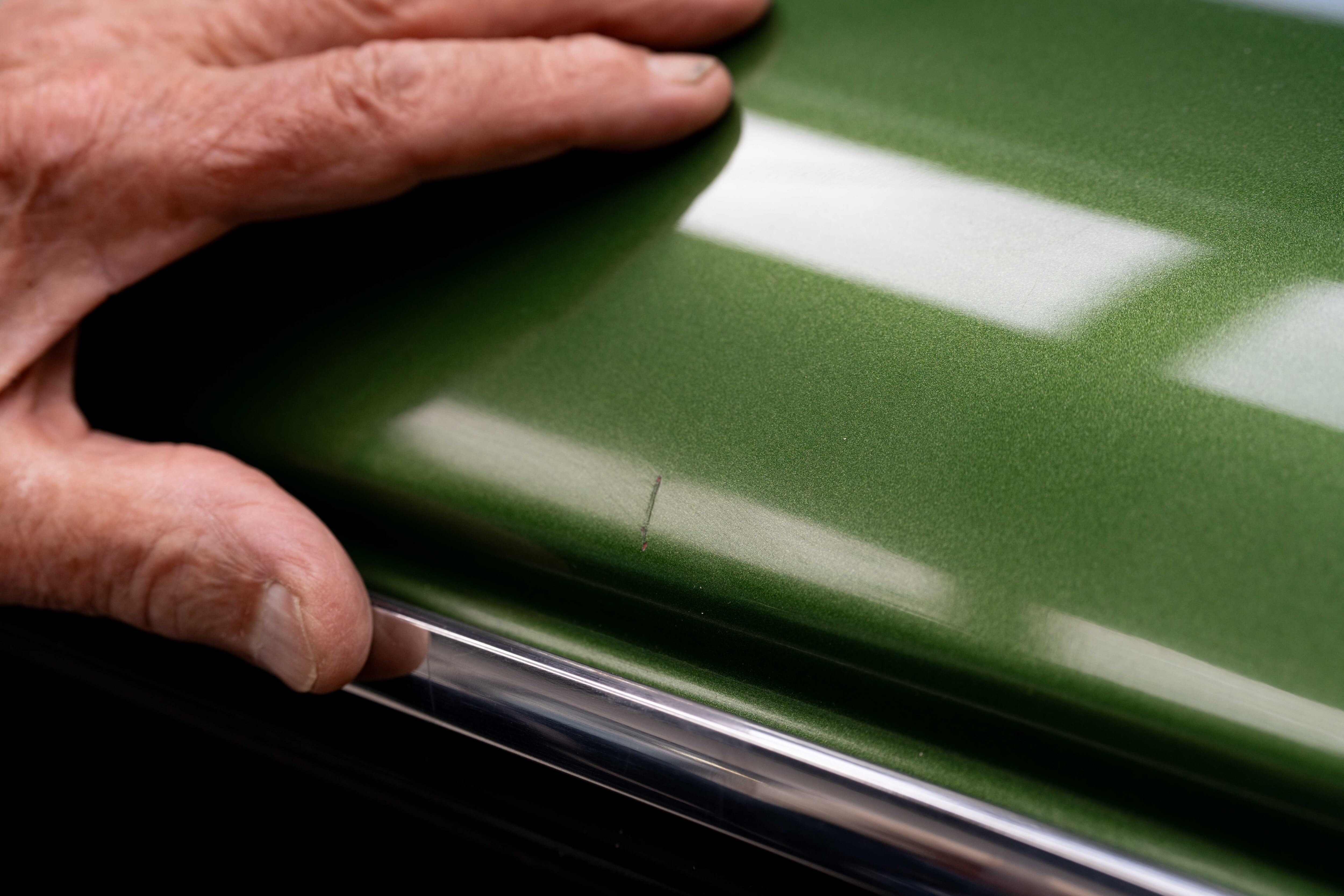 Scratch on green car