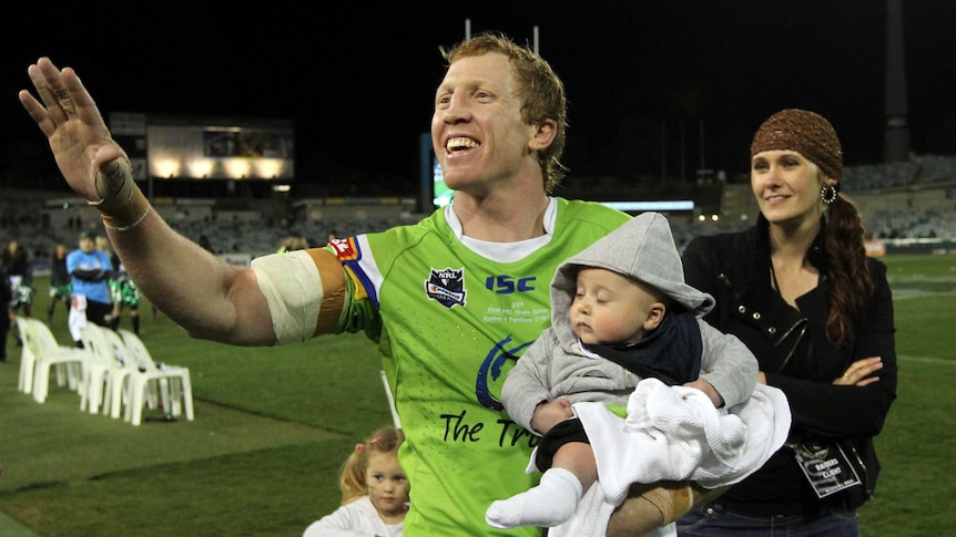 Alan Tongue does a lap of honour with his family at Canberra Stadium.