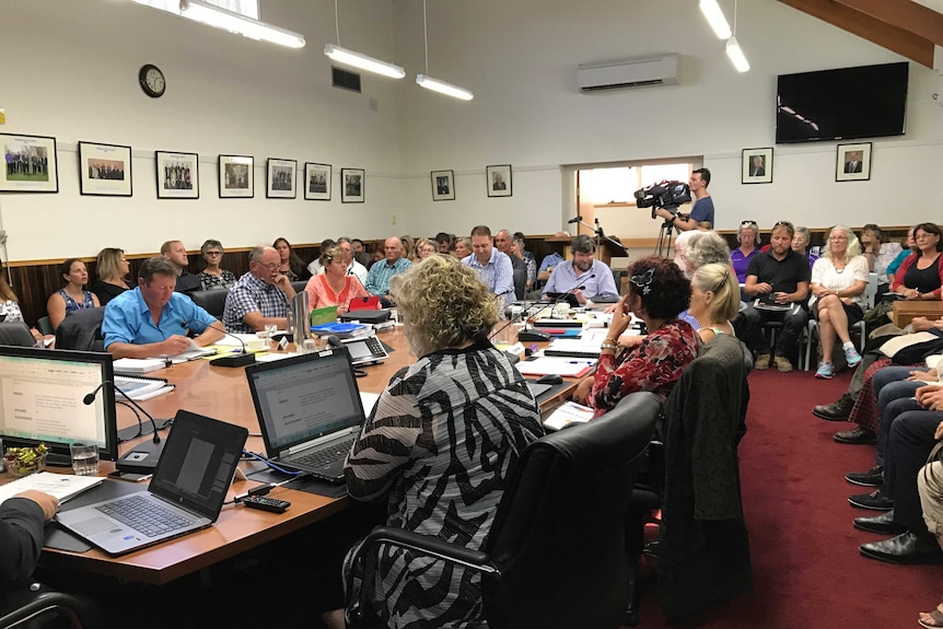 Packed  council chamber for meeting on Meander school