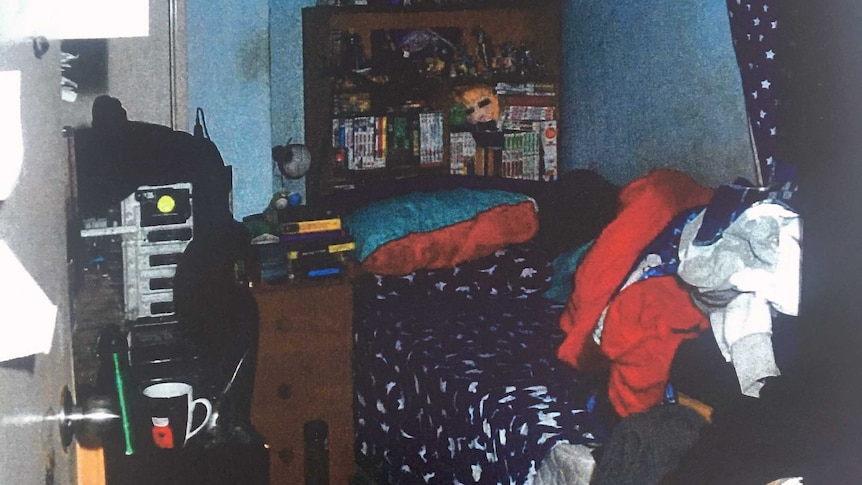 The room where Matthew Fisher-Turner was killed, with clothes heaped on to the bed.