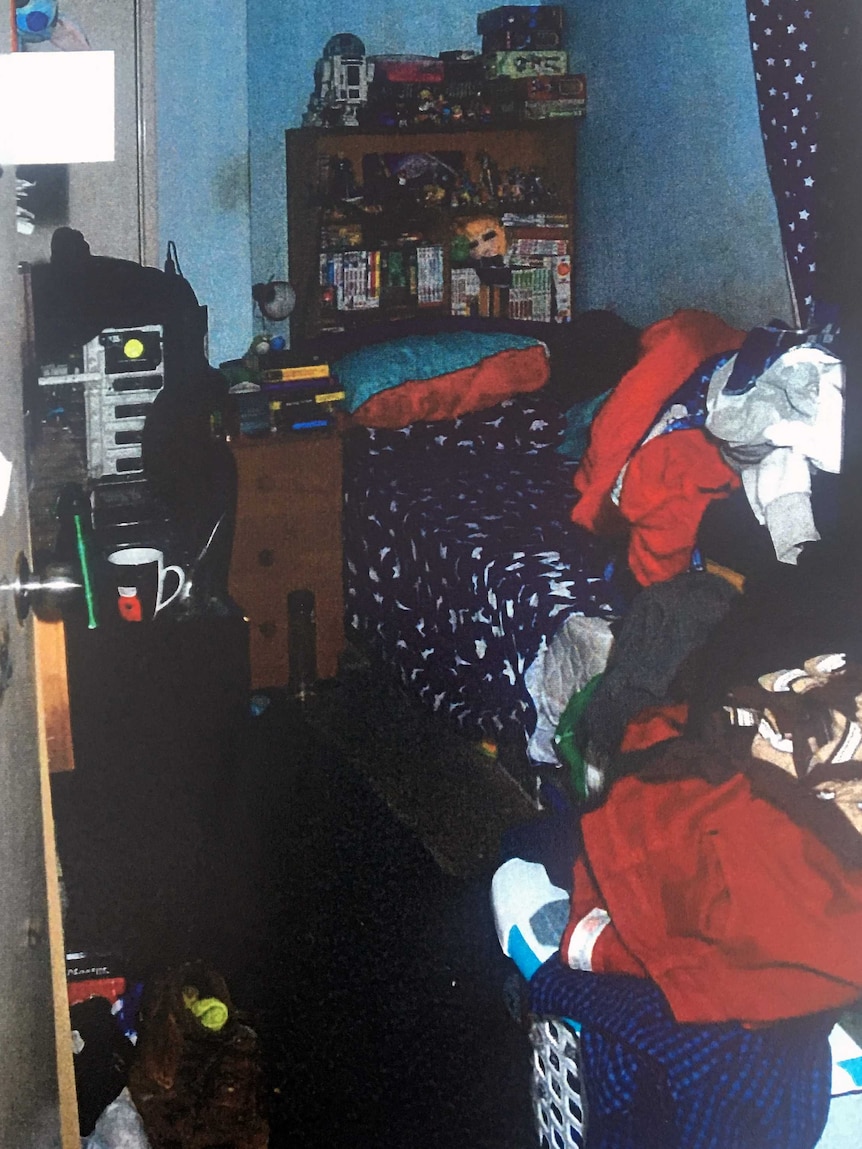 The room where Matthew Fisher-Turner was killed, with clothes heaped on to the bed.