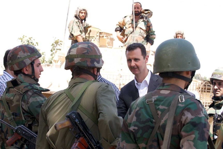Bashar al-Assad with troops
