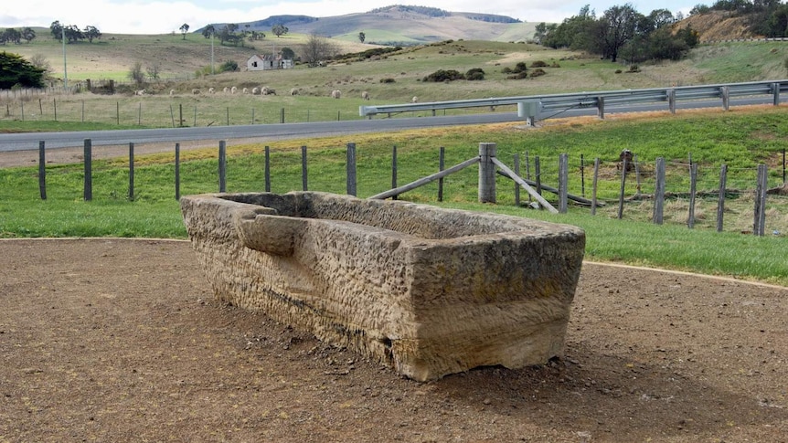 The sandstone horse watering trough by the roadside at Melton Mowbray, in Tasmania.